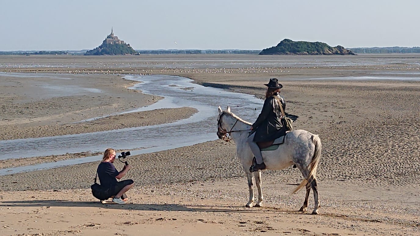 Yann directing a film shoot at Mont Saint-Michel